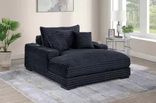 Black F8327 chaise lounge with three accent pillows in a furnished room